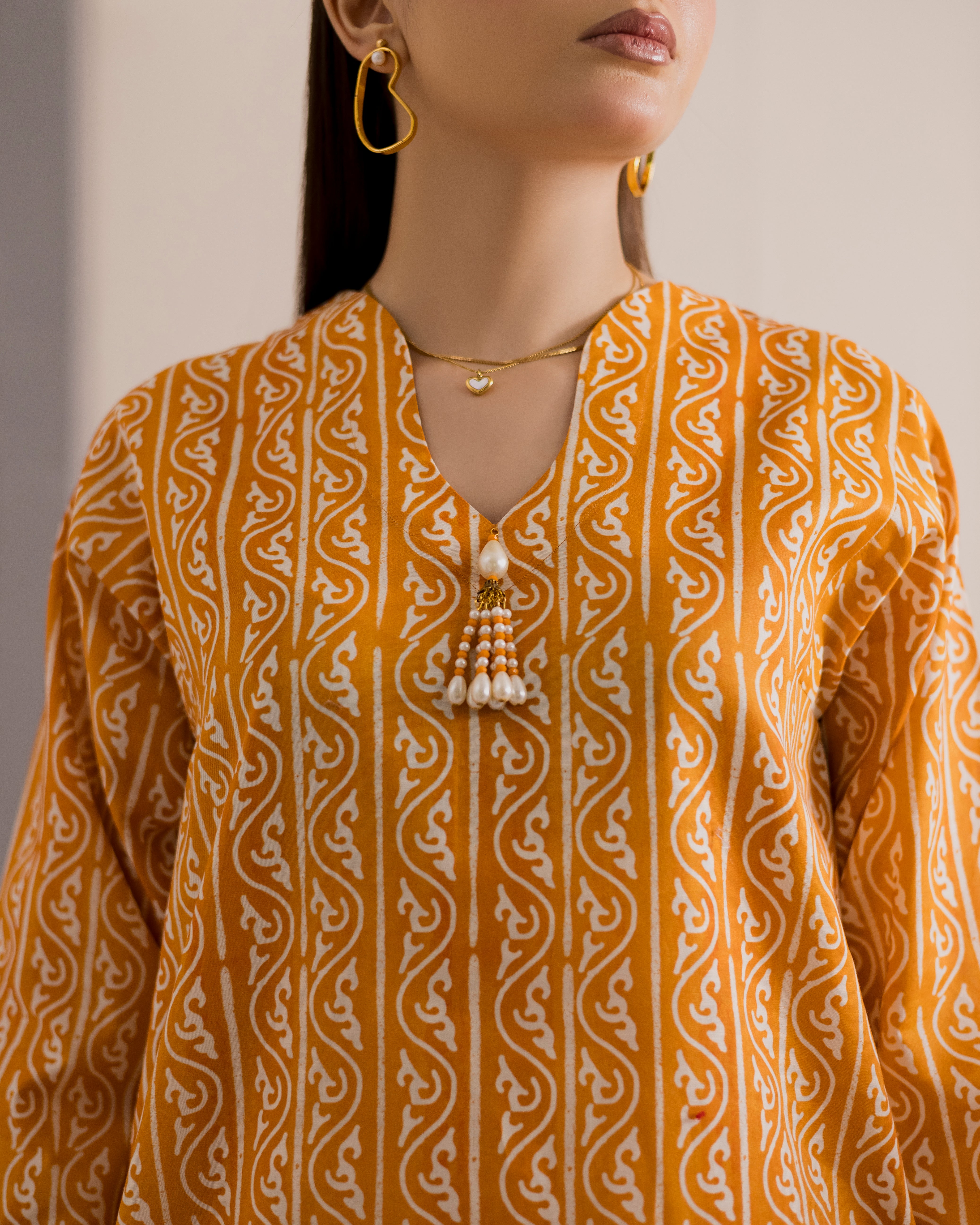Sunehri-white-and-mustard-printed-suit
